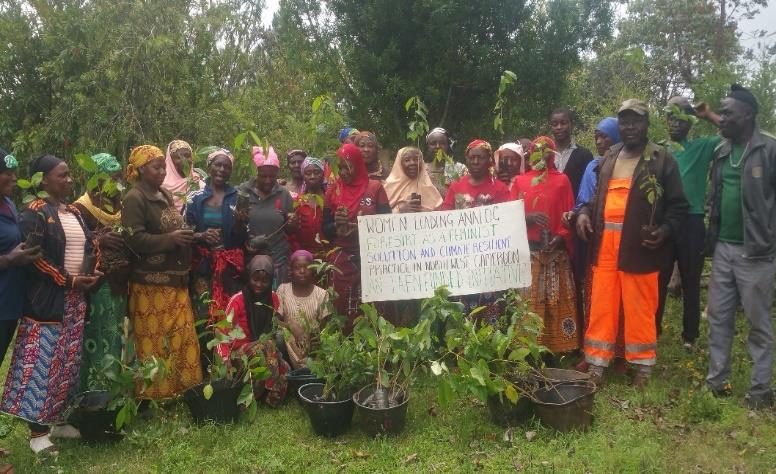 Women’s group with tree seedlings ready for planting